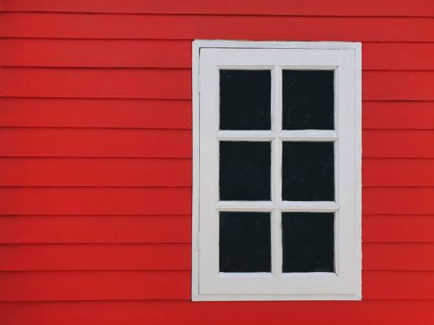 istock white window on red wooden wall 1340926489