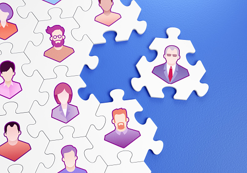Composed together hexagonal pieces of a jigsaw puzzle with pictured pictograms of staff persons and one of them is outside of a group. 3D-rendering graphics on the theme of Business Management.
