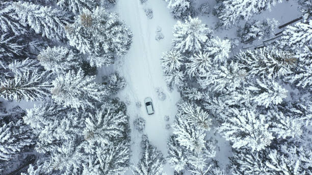 istock Car driving on winter country road 1340928265