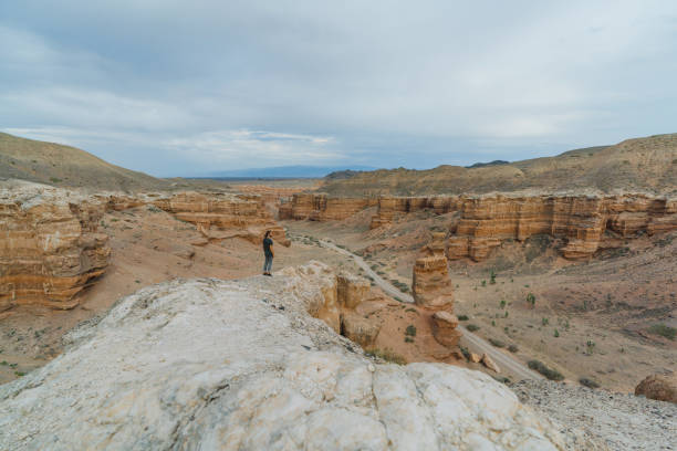 Young Caucasian man standing in canyon in Kazakhstan