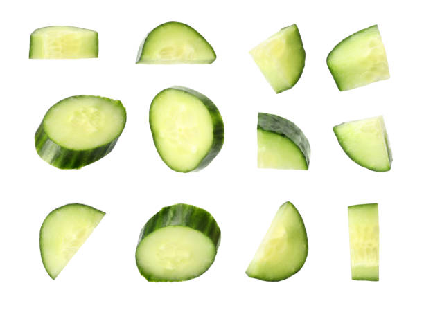 istock Set of fresh cucumber slices on white background 1340929561