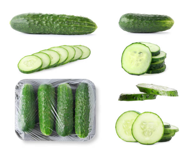 istock Set with whole and sliced cucumbers on white background 1340930992