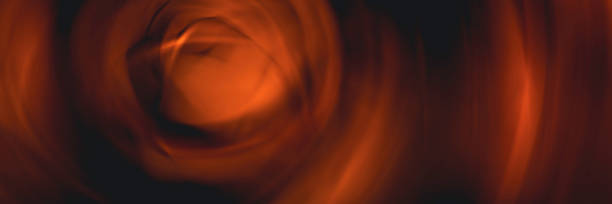 istock Abstract blurred geometric spinning motion background in orange and black colors 1340933148