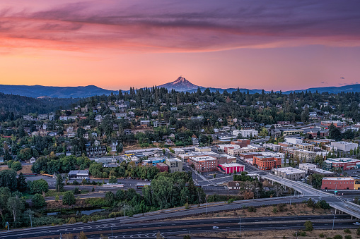 Aerial view at sunrise of the rural town of Hood River with Majestic Mount Hood in the background.