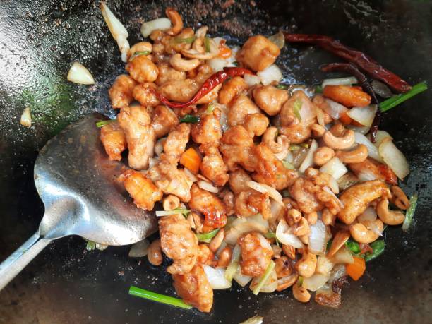 istock Making stir fried Chicken Cashew nut - Thai food. 1340937411