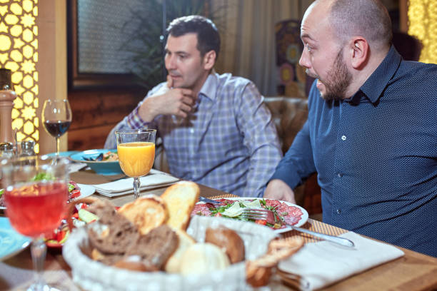 istock two men in a restaurant arguing during lunch 1340940588
