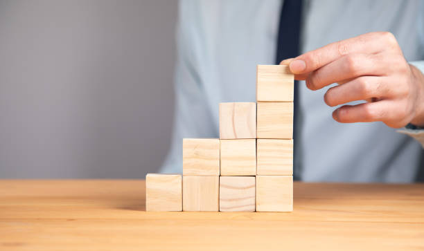 istock holding blank wooden block cubes 1340941380