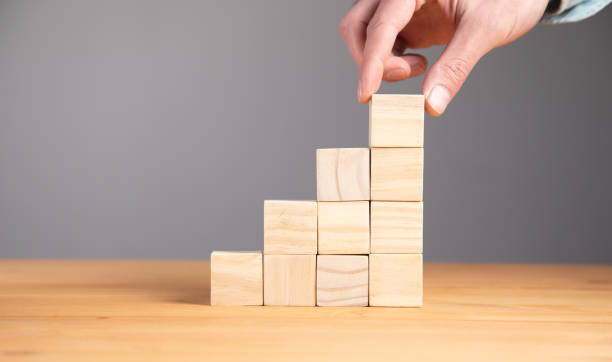 istock holding blank wooden block cubes 1340941392