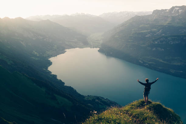istock Hiker relaxes at viewpoint on mountain, at sunrise 1340942668