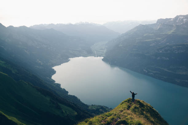 istock Hiker relaxes at viewpoint on mountain, at sunrise 1340942697