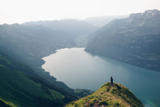 istock Hiker relaxes at viewpoint on mountain, at sunrise 1340942699