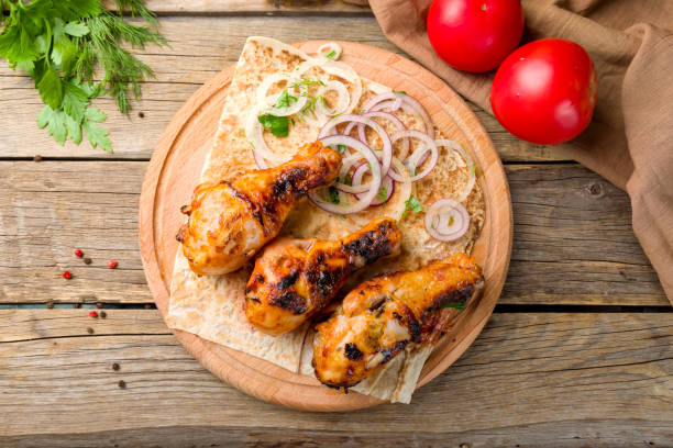 istock chicken drumstick kebab with sliced red onion on the board  top view 1340944294