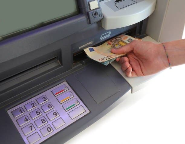 istock ATM and numeric keypad and hand with euro banknotes 1340944439
