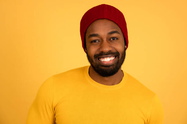 istock Afro man looking at the camera and smiling. 1340945655