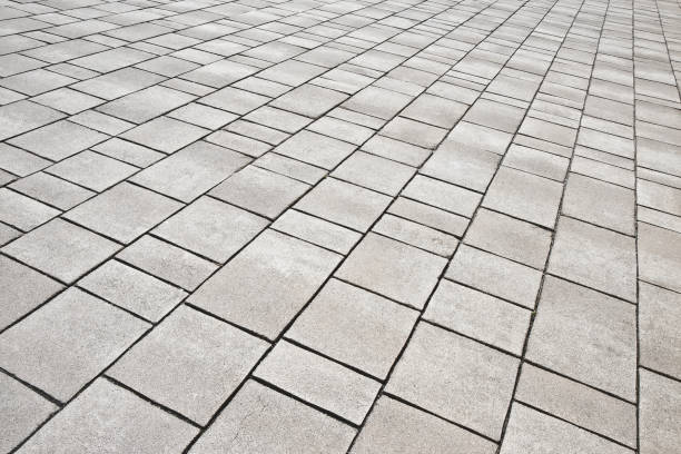 istock New paving made with stone blocks of rectangular shape in a pedestrian zone 1340948542