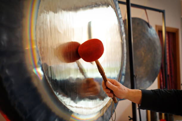 Sound therapy with gong Sound therapy with gong, It is important to be completely relaxed in order to be able to accept the sound and vibration of Gong to the fullest. gong stock pictures, royalty-free photos & images