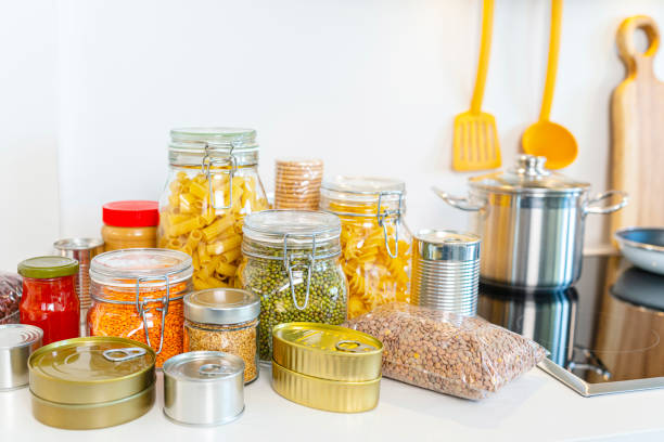 istock Canned food and food jars on kitchen counter 1340955868