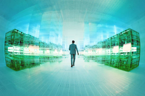 istock Businessman walking in futuristic data server room 1340956764