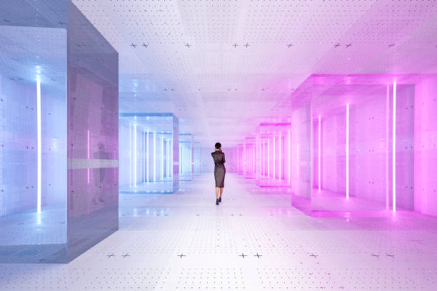 istock Businesswoman walking in futuristic data server room 1340956777