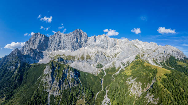 istock Mount Dachstein massif  -  mountain aerial panoramic view 1340957882