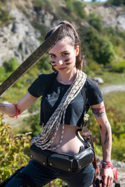 istock female holding machete at nature 1340958274