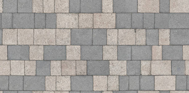istock Stone pavement texture. Abstract background of cobblestone pavement close-up. Seamless texture. Perfect tiled on all sides. 1340959321