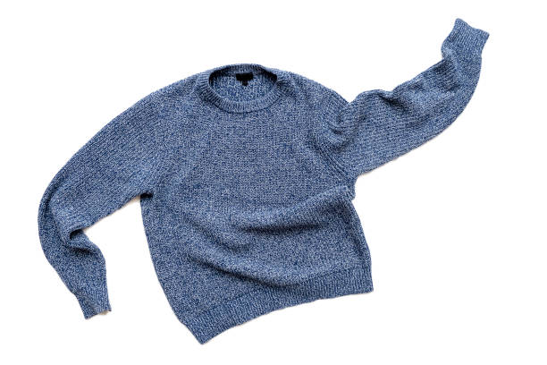 Blue sweater isolated on white, casual vintage knitted sweater, wool cardigan, top view stock photo