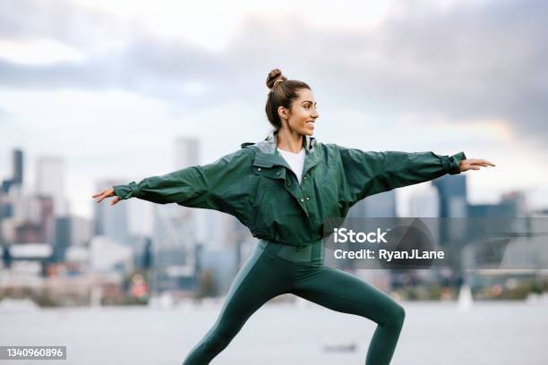 Woman Stretching And Meditating By Seattle Waterfront Stock Photo - Download Image Now