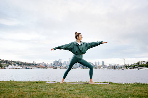 istock Woman Stretching and Meditating By Seattle Waterfront 1340960897