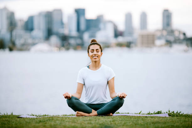 istock Woman Stretching and Meditating By Seattle Waterfront 1340960909