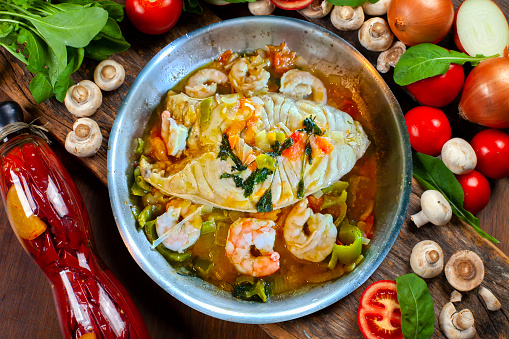 Moqueca, a traditional Brazilian dish with badejo fish and large shrimp, Badejo