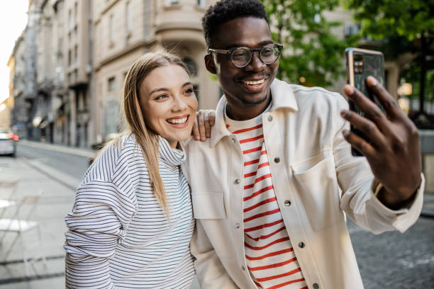 istock Friends taking selfie on the street 1340966768