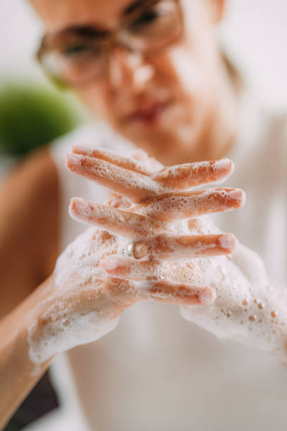 istock Obsessive compulsive disorder concept. Woman Obsessively Washing her Hands. 1340967053