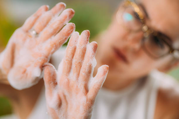 istock Obsessive compulsive disorder concept. Woman Obsessively Washing her Hands. 1340967693