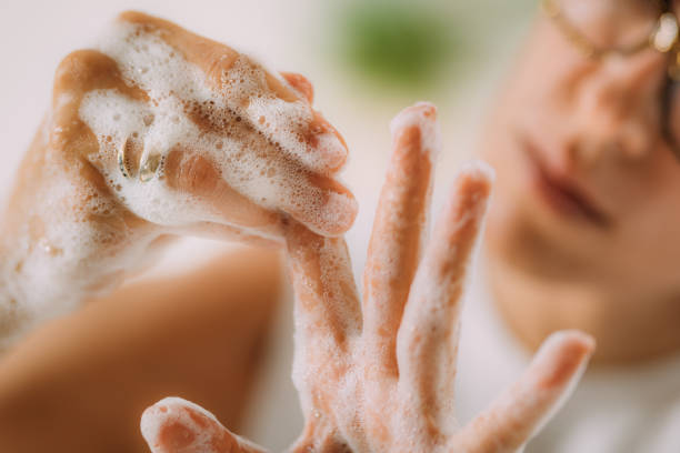 istock Obsessive compulsive disorder concept. Woman Obsessively Washing her Hands. 1340967718