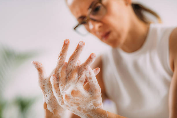 istock Obsessive compulsive disorder concept. Woman Obsessively Washing her Hands. 1340967802