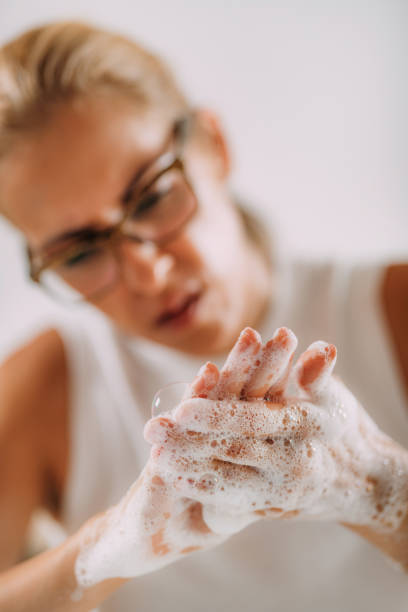 istock Obsessive compulsive disorder concept. Woman Obsessively Washing her Hands. 1340967847