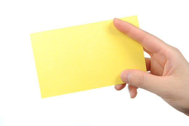 istock Empty yellow business card in a woman's hand 134096827
