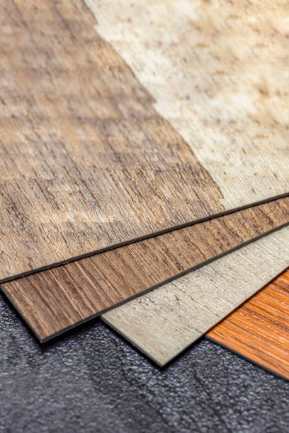 istock Vinyl floor, wood samples. Small colored boards. Image for design with copy space on black vinyl floor background 1340969888