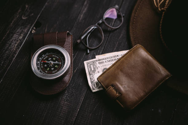 istock vintage banknotes on wooden board with old vintage compass 1340970216