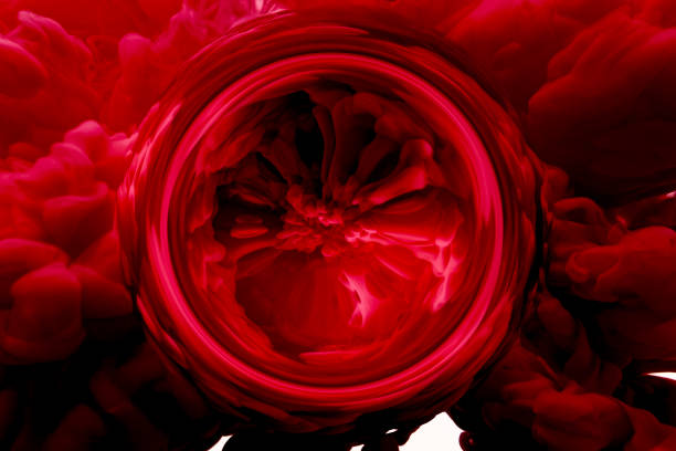 Blue ink dropped in water on white background, Slow motion