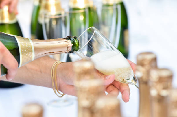 istock Champagne Pouring Into a Single Glass 1340971712
