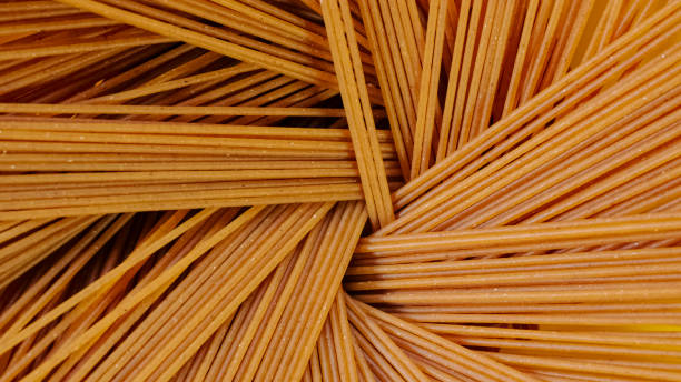 close up of penne pasta as background