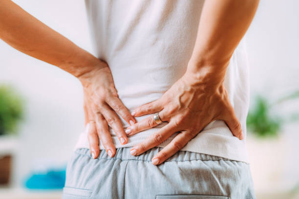 Sciatic Nerve Inflammation, Lower Back Pain Sciatica or sciatic nerve inflammation, lower back pain. Woman with sciatic nerve pain in her lower back. pain photos stock pictures, royalty-free photos & images