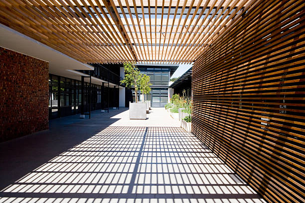 Op-art pergola Japanese-style trelliswork on the roof of a trendy modern office block. Camera: Canon 5D. modern roof stock pictures, royalty-free photos & images