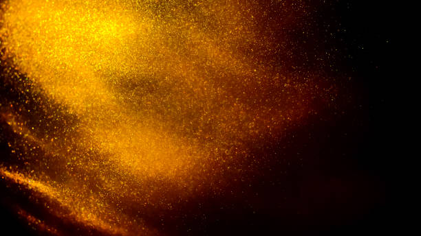 istock Golden paint cloud with glitter in water isolated on black background 1340974172