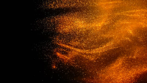 istock Golden paint cloud with glitter in water isolated on black background 1340974178