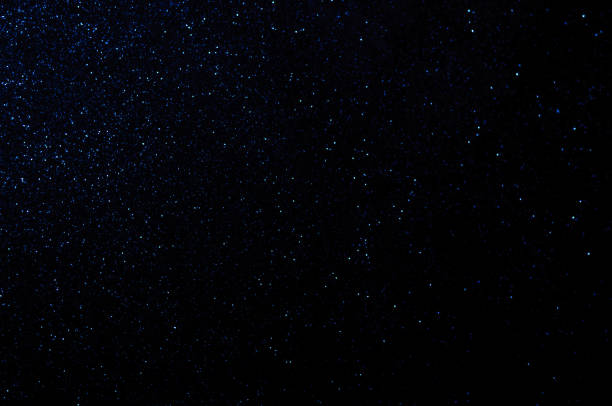 istock defocused blue lights, shiny particles, space, stars, abstract background 1340975757