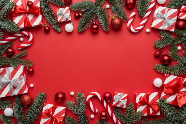 istock Christmas background with frame decorated with festive gifts and spruce branches 1340980201