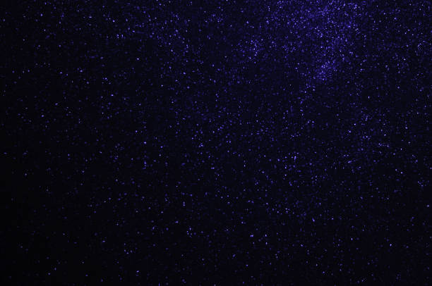 istock Twinkling stars in space,shiny particles, Defocused Blue Lights, Abstract Backgrounds 1340981965